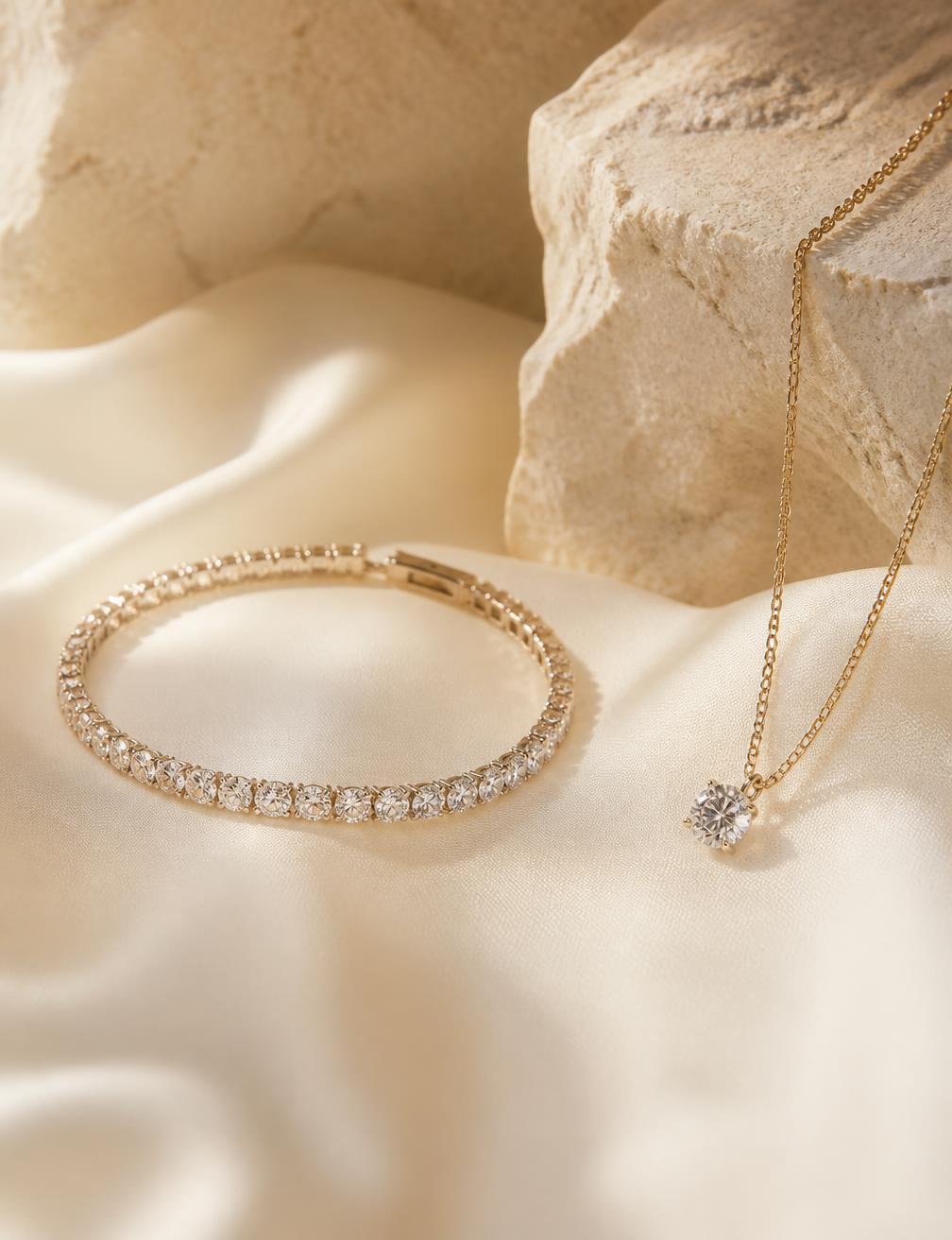 Diamond tennis bracelet and pendant on ivory silk